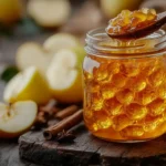 What Can I Use to Thicken Apple Pie Filling for Canning? 8 Spoon scooping thick apple pie filling into a mason jar