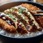 Crispy Japanese Katsu Bowls 5 Crispy Japanese Katsu Bowls with panko breaded chicken over steamed rice, drizzled with tonkatsu sauce and creamy mayo, served with chopsticks
