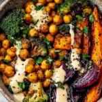 Vegan Roasted Vegetable & Chickpea Bowl with Tahini Sauce 5 A nourishing dinner scene shows a speckled bowl packed with roasted vegetables, roasted veggies chickpeas, and ribbons of tahini dressing, embodying a Vegan Roasted Vegetable and Chickpea Bowl with Tahini Sauce that mirrors roasted veggie tahini bowls and aligns with healthy recipes that celebrate tahini.