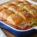 Hot Italian Sub Sliders with melty provolone, deli meats, and banana peppers on soft Hawaiian rolls