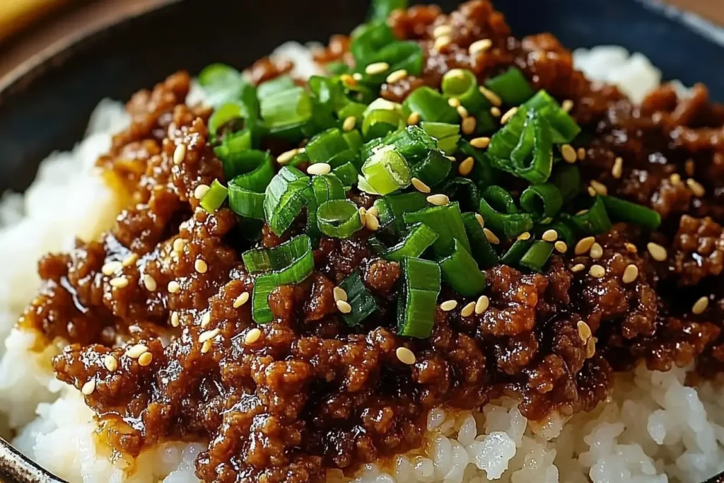 Korean Ground Beef Bowl over steamed rice topped with green onions and sesame seeds, an easy weeknight dinner with sweet savory sauce