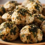 Korean rice balls Jumeokbap with seaweed and sesame on a plate