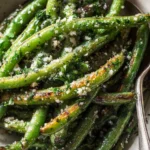 Oven-roasted green beans with garlic and Parmesan on a sheet pan, crispy edges, easy vegetable side dish
