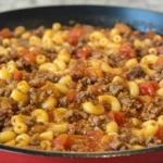 Ultimate American Goulash - Secrets how to build deeper flavor in one-pot 5 Skillet of American Goulash with elbow macaroni, ground beef, and diced tomatoes simmering in a rich tomato sauce, an easy one pot goulash recipe for a cozy weeknight dinner