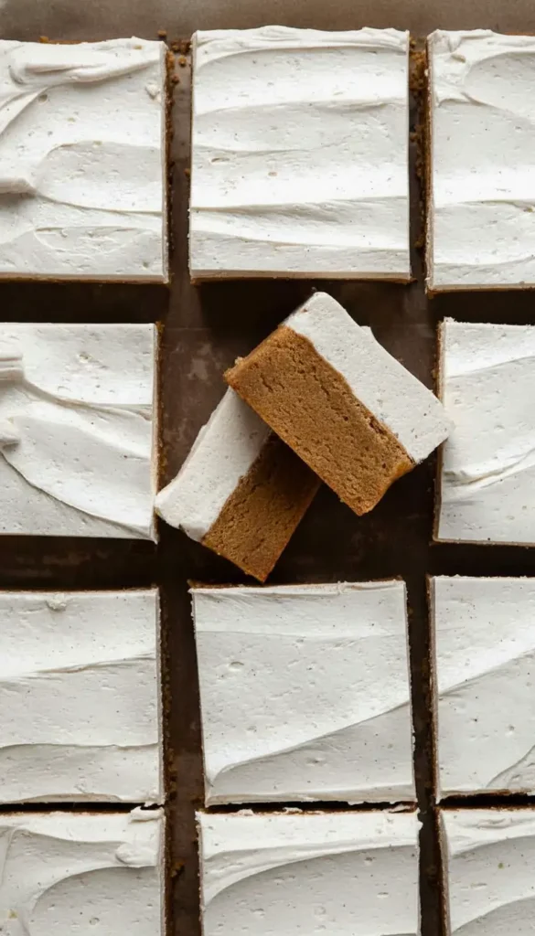 Close-up of Frosted Gingerbread Brownies, dense gingerbread bars topped with fluffy cinnamon frosting for an easy Christmas dessert