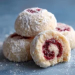 Raspberry Filled Almond Snowball Cookies S Featured e1762694328753 Raspberry-Filled Almond Snowball Cookies