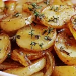 Slow Cooker Lipton Onion Potatoes with golden sliced potatoes, caramelized onions, and thyme, tender and buttery crockpot side dish