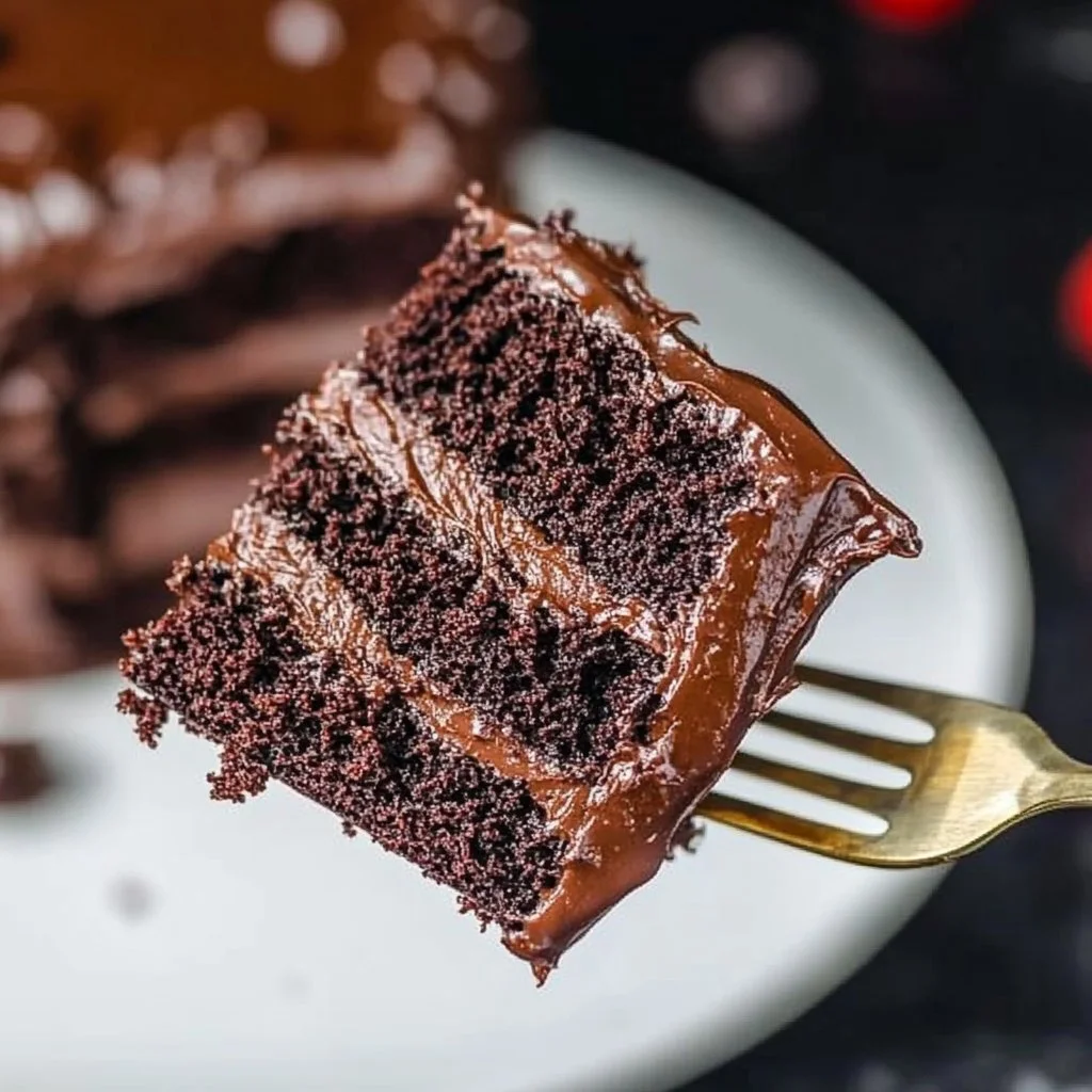 Decadent Death by Chocolate Cake topped with rich chocolate ganache